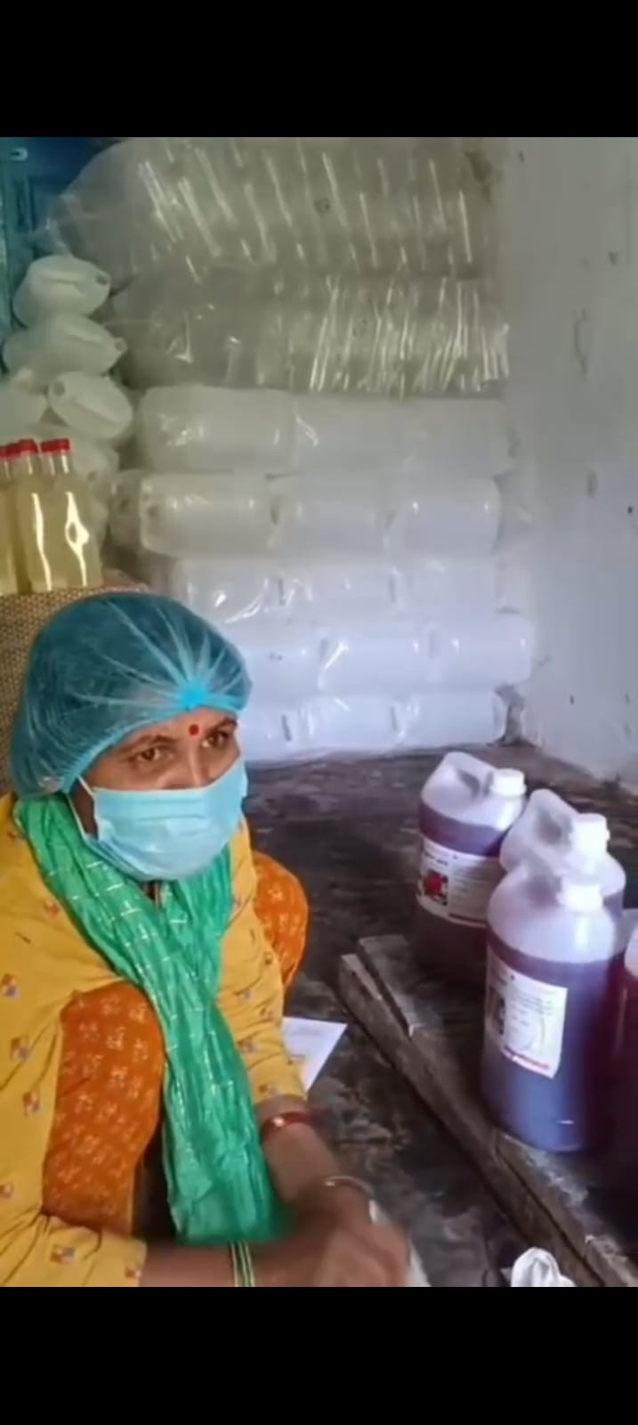 A woman producer working with bottled juice